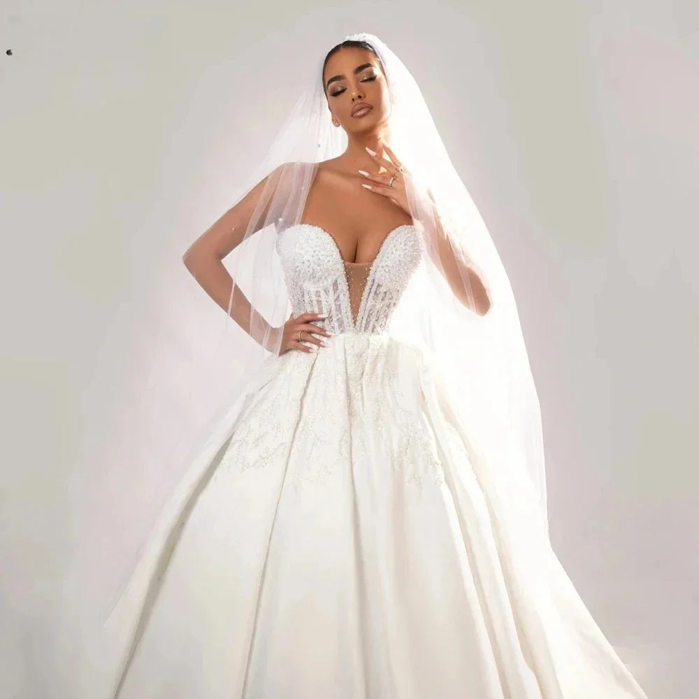 Sweetheart pearls beads sleeveless satin A-line 2026 exquisite shiny wedding dress bridal gown ivory
