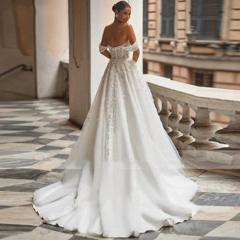 Elegant A-line tulle off-shoulder lace appliques floor length vintage bridal gown front view