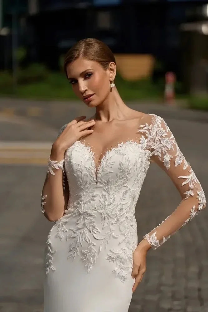 Long sleeve sheer neck lace mermaid wedding dress 2025 beach sweep train side view