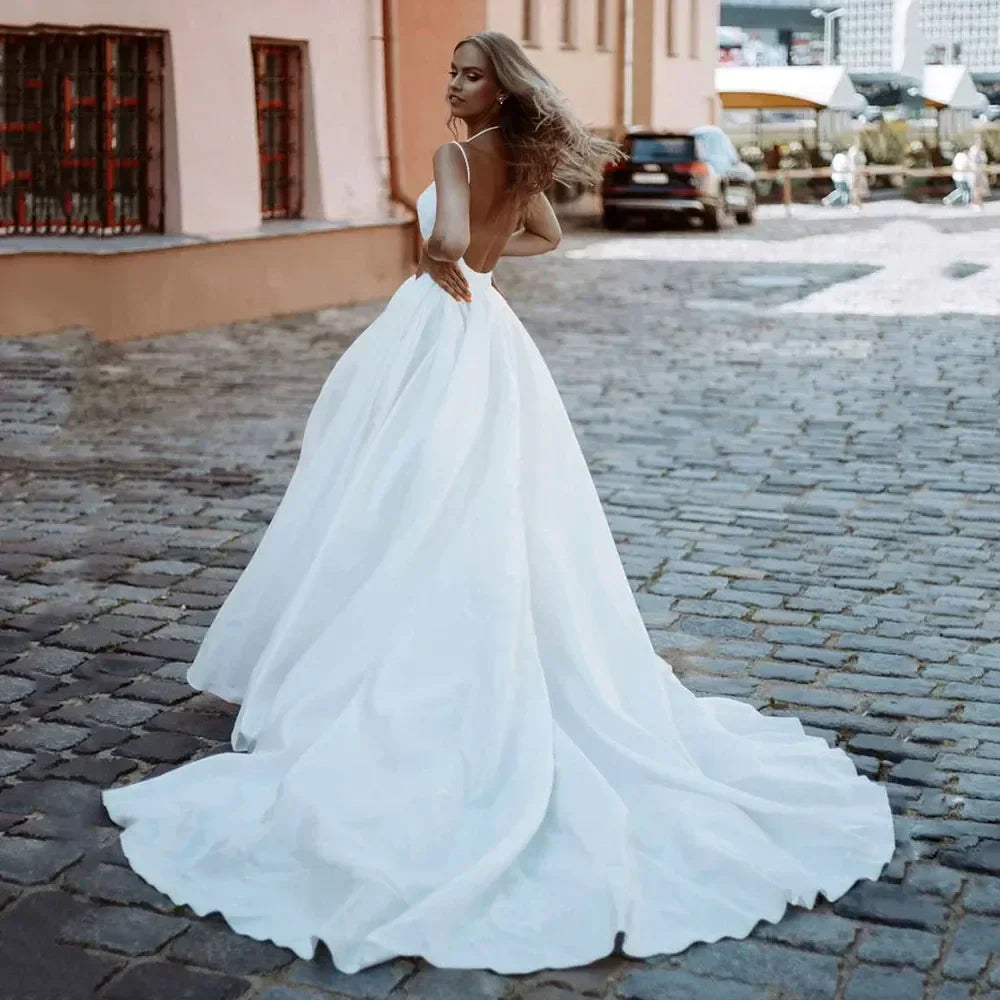 Classy long plus size V-neck sleeveless backless slit A-line sweep train bridal gown front view