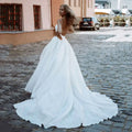 Plus size V-neck sleeveless backless slit A-line classy long sweep train bridal gown side view