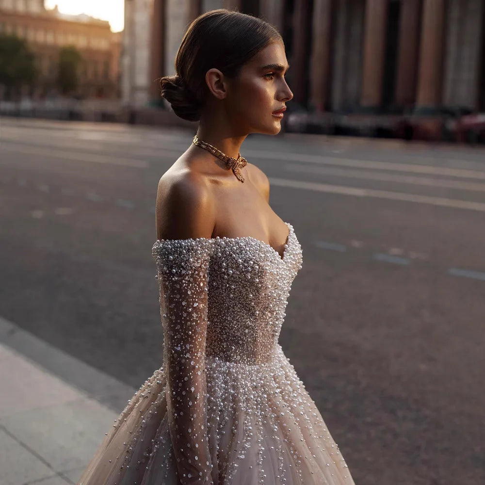 Luxury champagne wedding dress off-the-shoulder long sleeves pearls beads sweep train bridal gown