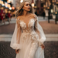 Puff sleeve V-neck A-line lace modern backless tulle sweep train bridal gown side view