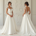 Timeless satin and lace wedding dress with sweetheart neckline, lace cap sleeves, and deep V-back