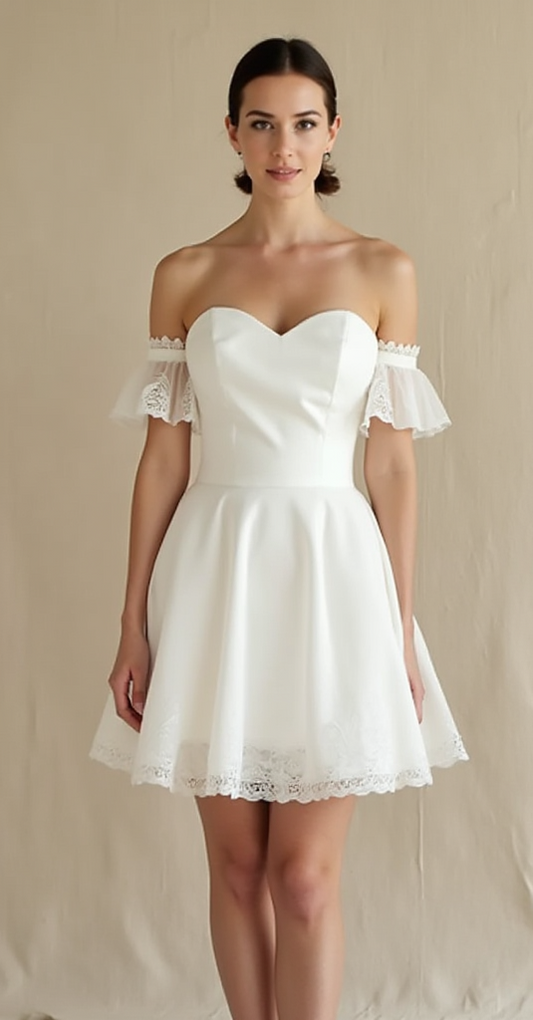 A stylish short off-the-shoulder wedding dress with flutter sleeves, a sweetheart bodice, and an A-line skirt with lace hem – perfect for modern brides.
فستان زفاف قصير أنيق مكشوف الأكتاف بأكمام منسدلة، وكورسيه بقصة قلب، وتنورة A-line بحواف دانتيل – مثالي للعروس العصرية.
Un elegante vestido de novia corto con hombros descubiertos, mangas vaporosas, corpiño con escote corazón y falda acampanada con encaje – perfecto para novias modernas.