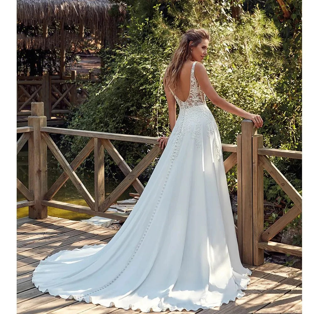 Lace tulle V-neck modern sleeveless button open back court train pleat wedding dress side view