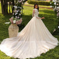 Luxury puff sleeve O-neck lace embroidery ball gown open back sweep train bride wedding dress side view